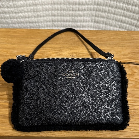 Coach Handbags - Coach Black Shearling Pebble Leather Small Wristlet Silver Hardware Pom Pom
